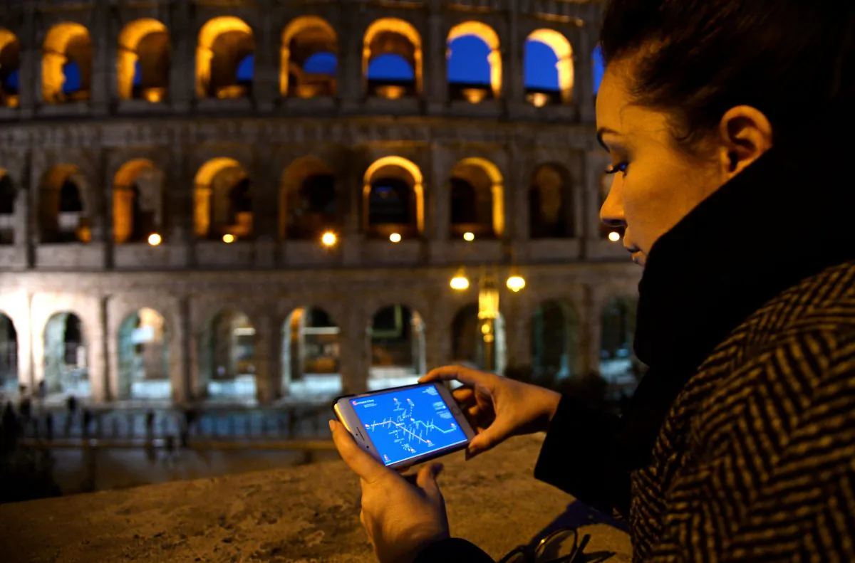 A woman with a smartphone in Rome, Italy, Feb. 14, 2017. (Filippo Mmonteforte/AFP/Getty Images)