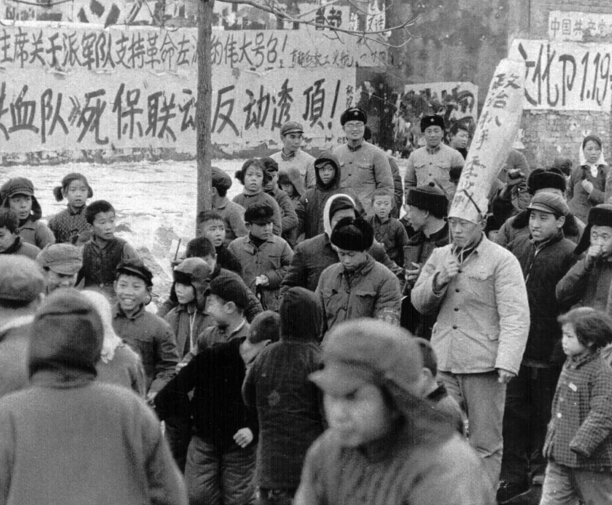A Chinese official is paraded through the streets of Beijing by Red Guards on Jan. 25, 1967. The words on his dunce cap accuses him of being a "political pickpocket." During Mao Zedong's reign (1949-1977), many Chinese citizens and officials were accused of political crimes, and labeled "class enemies" and "counter-revolutionaries."  (Associated Press)