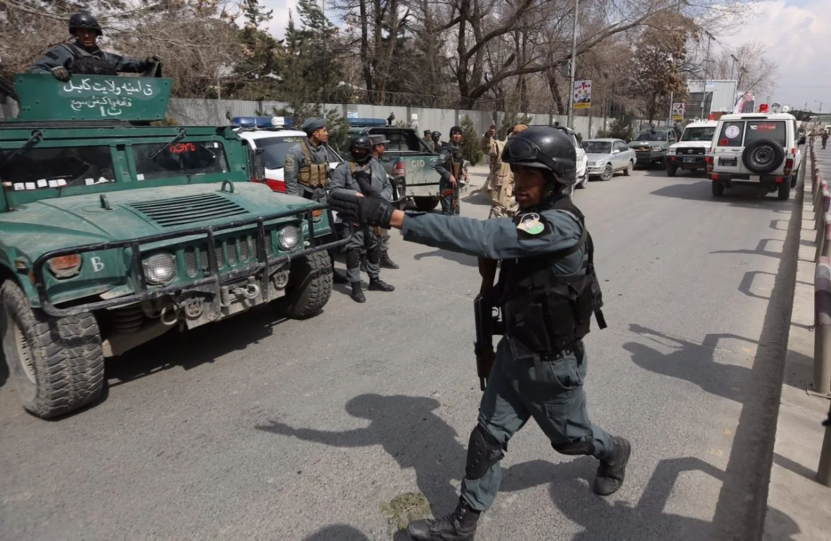 Security forces inspect the site of attack on a military hospital in Kabul, Afghanistan on March 8, 2017. (AP Photo/Rahmat Gul)