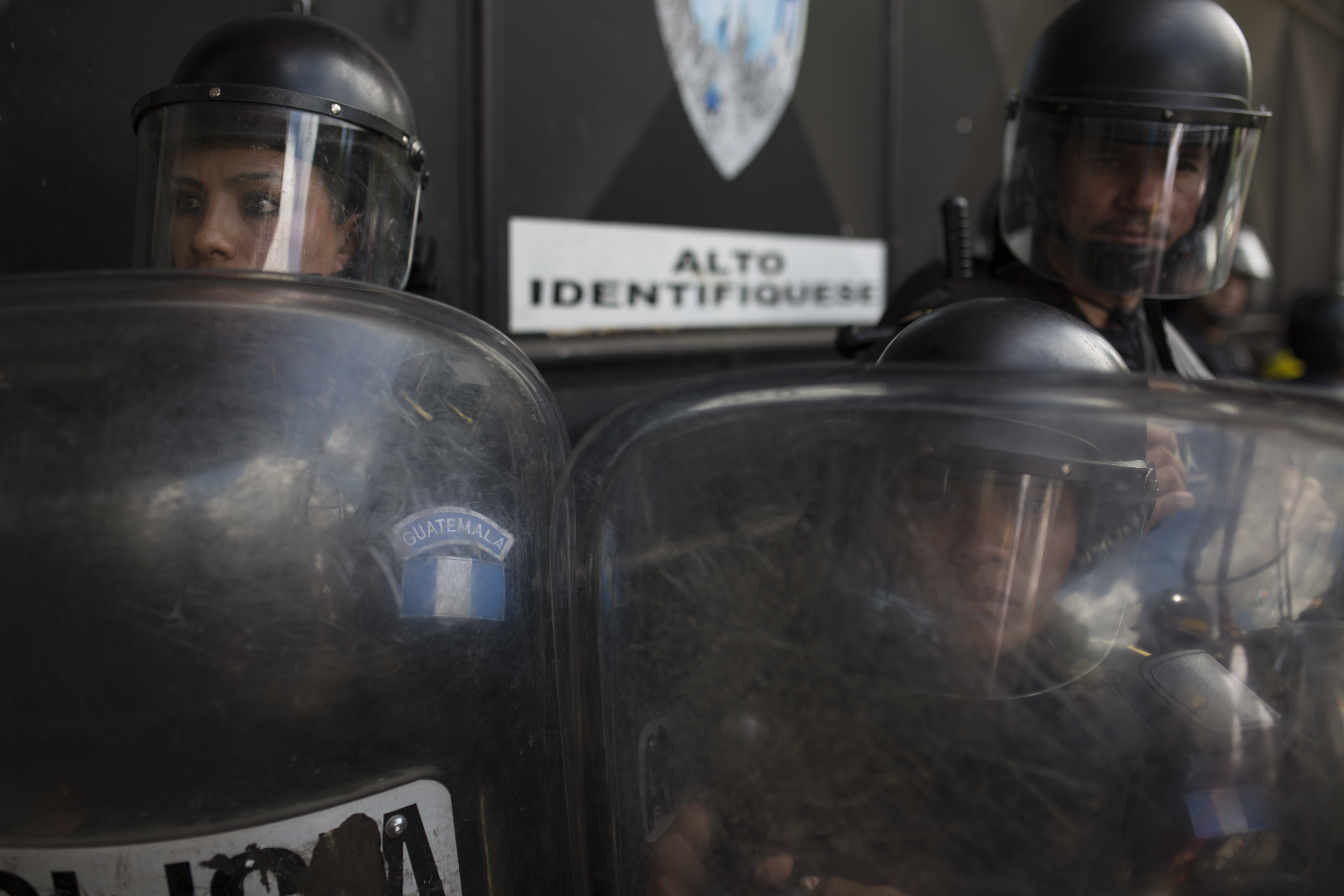 National Police safeguard the entrance to the Virgen de la Asunción children's shelter, in San Jose Pinula, Guatemala, on March 8, 2017. (AP Photo/Luis Soto)