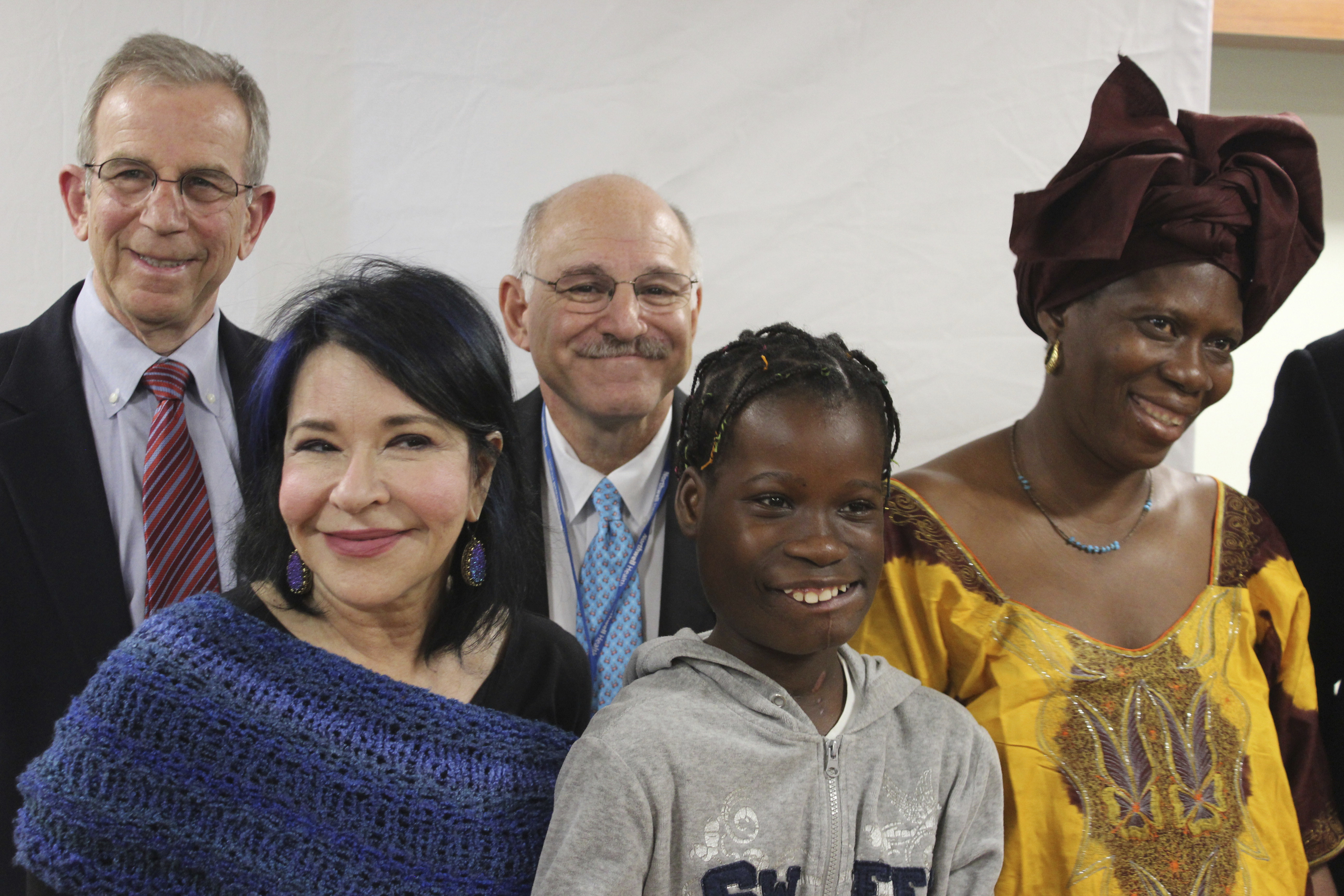 Janet Sylva, second from right, and her mother, Philomena, right, meet with surgeons and others at Cohen Children's Medical Center in New Hyde Park, N.Y., on March 9, 2017. (AP Photo/Frank Eltman)