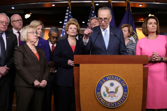 Senate Minority Leader Chuck Schumer (D-N.Y.) and fellow Democrats from both the House and Senate, including House Minority Leader Nancy Pelosi (D-Calif.) (R), at the U.S. Capitol on Jan. 4. (Chip Somodevilla/Getty Images)
