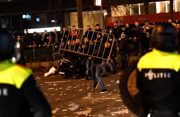 Riot police clash with demonstrators in the streets near the Turkish consulate in Rotterdam, Netherlands March 12, 2017. (REUTERS/Dylan Martinez)
