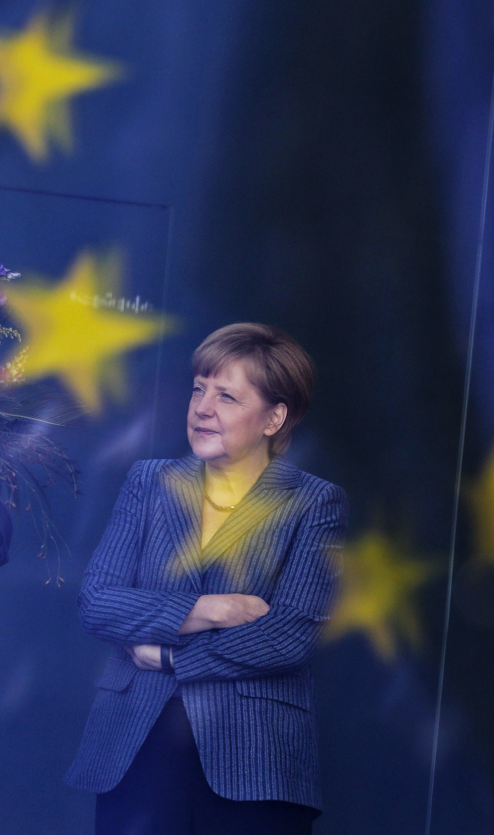 German Chancellor Angela Merkel stands at the chancellery in Berlin on June 2, 2014. (AP Photo/Markus Schreiber, file)