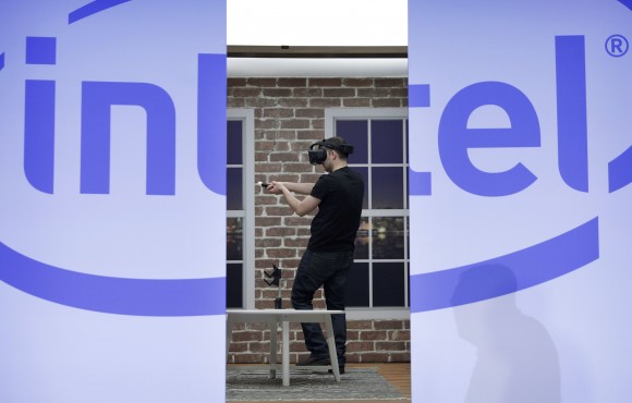 A model demonstrates a Project Alloy all-in-one merged reality headset during an Intel news conference before CES International, in Las Vegas onIn this Wednesday, Jan. 4, 2017, fi. Intel is buying Mobileye in a deal announced Monday, March 13, 2017 and valued at about $14.09 billion, the latest push by a major tech company into autonomous vehicles that could change the way traffic moves globally. (AP Photo/John Locher, File)