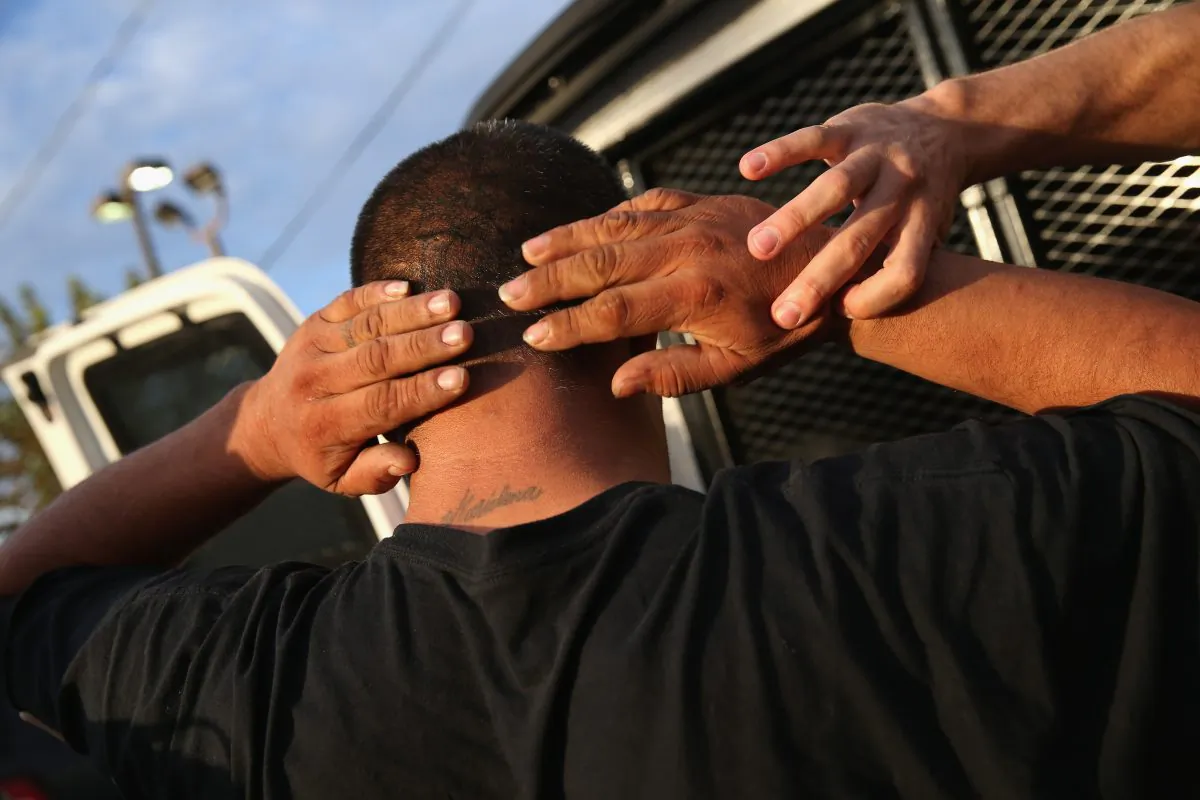 U.S. Immigration and Customs Enforcement (ICE), agents detain an immigrant in Los Angeles, Calif. on October 14, 2015. (Photo by John Moore/Getty Images)