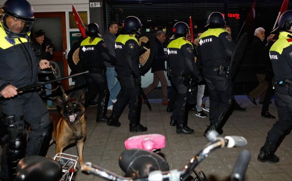 Policemen break up protests that erupted around the Turkish consulate after Dutch authorities barred Turkish ministers from visiting, early in Rotterdam in the Netherlands on March 12, 2017. (BAS CZERWINSKI/AFP/Getty Images)