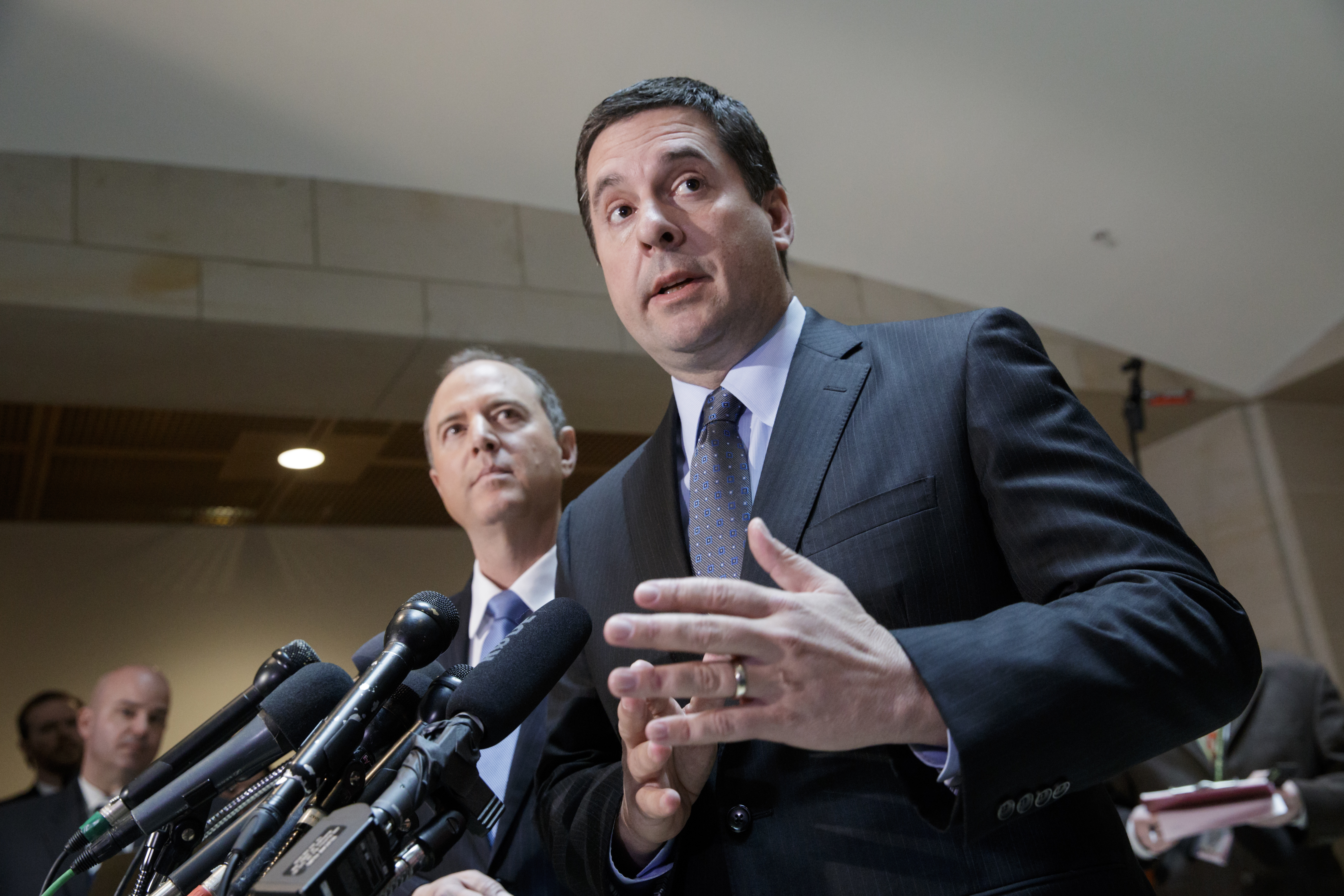 House Intelligence Committee Chairman Rep. Devin Nunes, R-Calif. (R) accompanied by the committee's ranking member, Rep. Adam Schiff, D-Calif., talks to reporters, on Capitol Hill in Washington on March, 15, 2017. (AP Photo/J. Scott Applewhite)