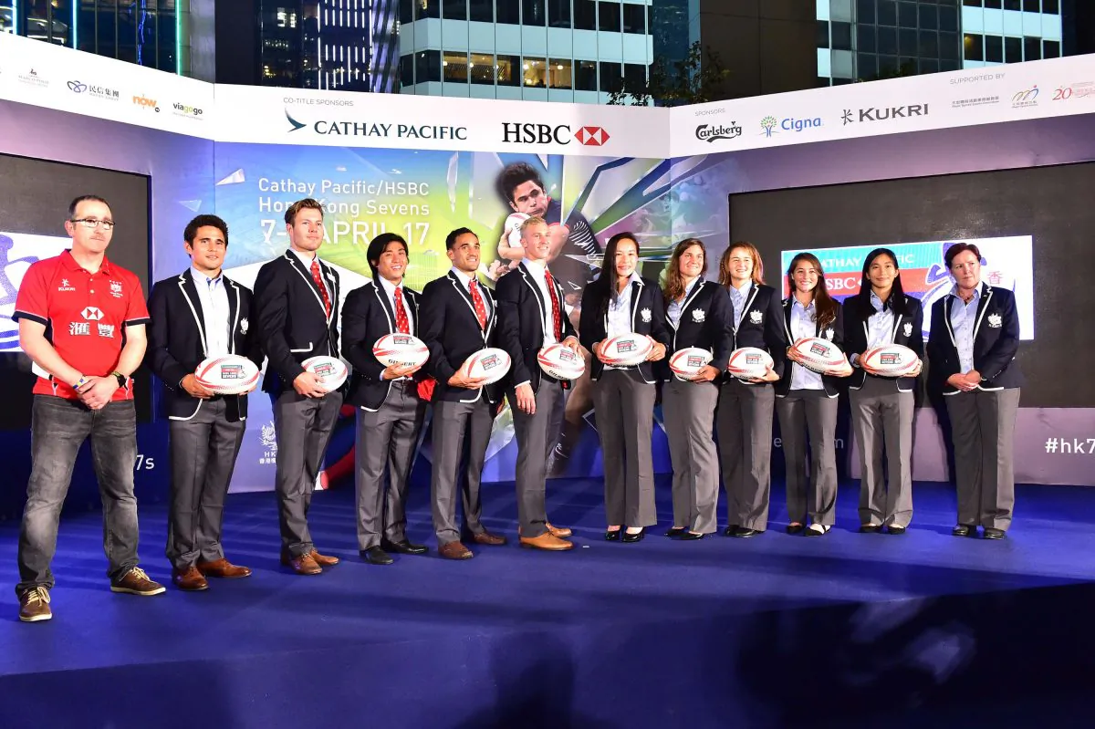 Paul John (L) and Anna Richards (R) with members of the HKG Men's and Women's Rugby 7s Squads at the Sevens draw in Hong Kong on Monday March 13, 2017. (Bill Cox/Epoch Times)