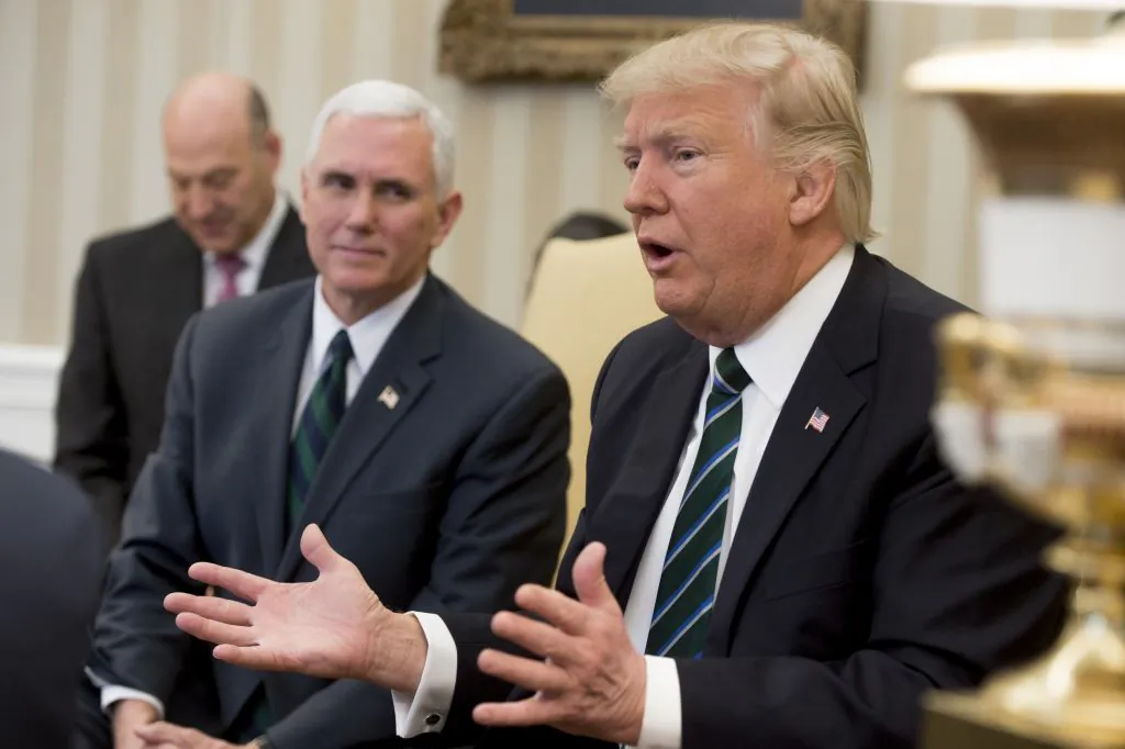 US President Donald Trump speaks alongside US Vice President Mike Pence (L) during a meeting about his healthcare plan with members of Congress in the Oval Office of the White House in Washington, DC, on March 17, 2017. (SAUL LOEB/AFP/Getty Images)