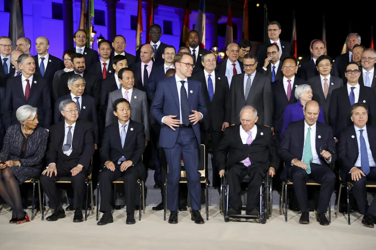 German Bundesbank President Jens Weidmann (C) arrives for the family picture during the G20 Finance Ministers and Central Bank Governors Meeting in Baden-Baden, Germany, March 17, 2017. (REUTERS/Kai Pfaffenbach)