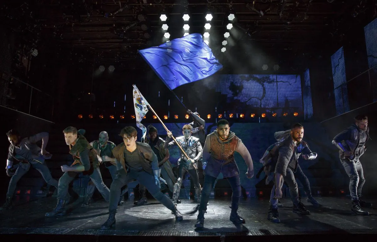 The company of “Joan of Arc: Into the Fire,” with Jo Lampert (center) as Joan. (Joan Marcus)