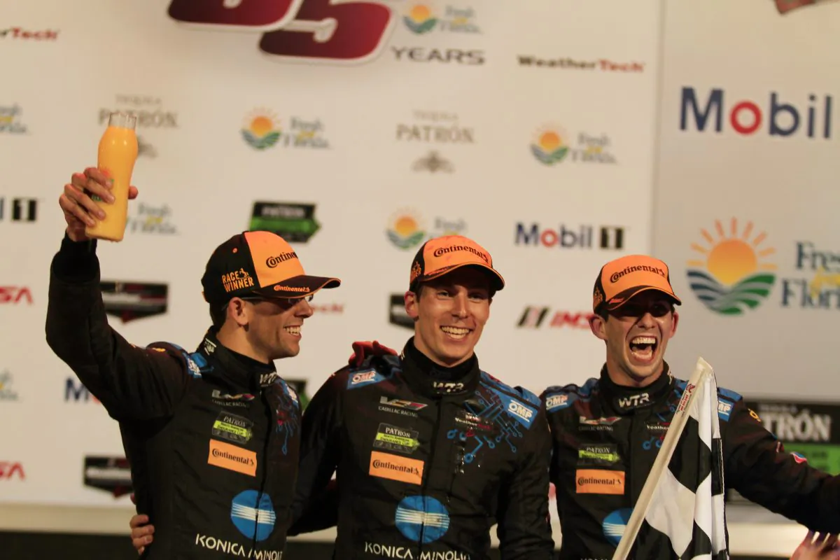 Jordan Taylor, Alex Lynne, and Ricky Taylor celebrate after winning the 2017 IMSA Twelve Hours of Sebring, March 18. (Chris Jaurek/Epoch Times)