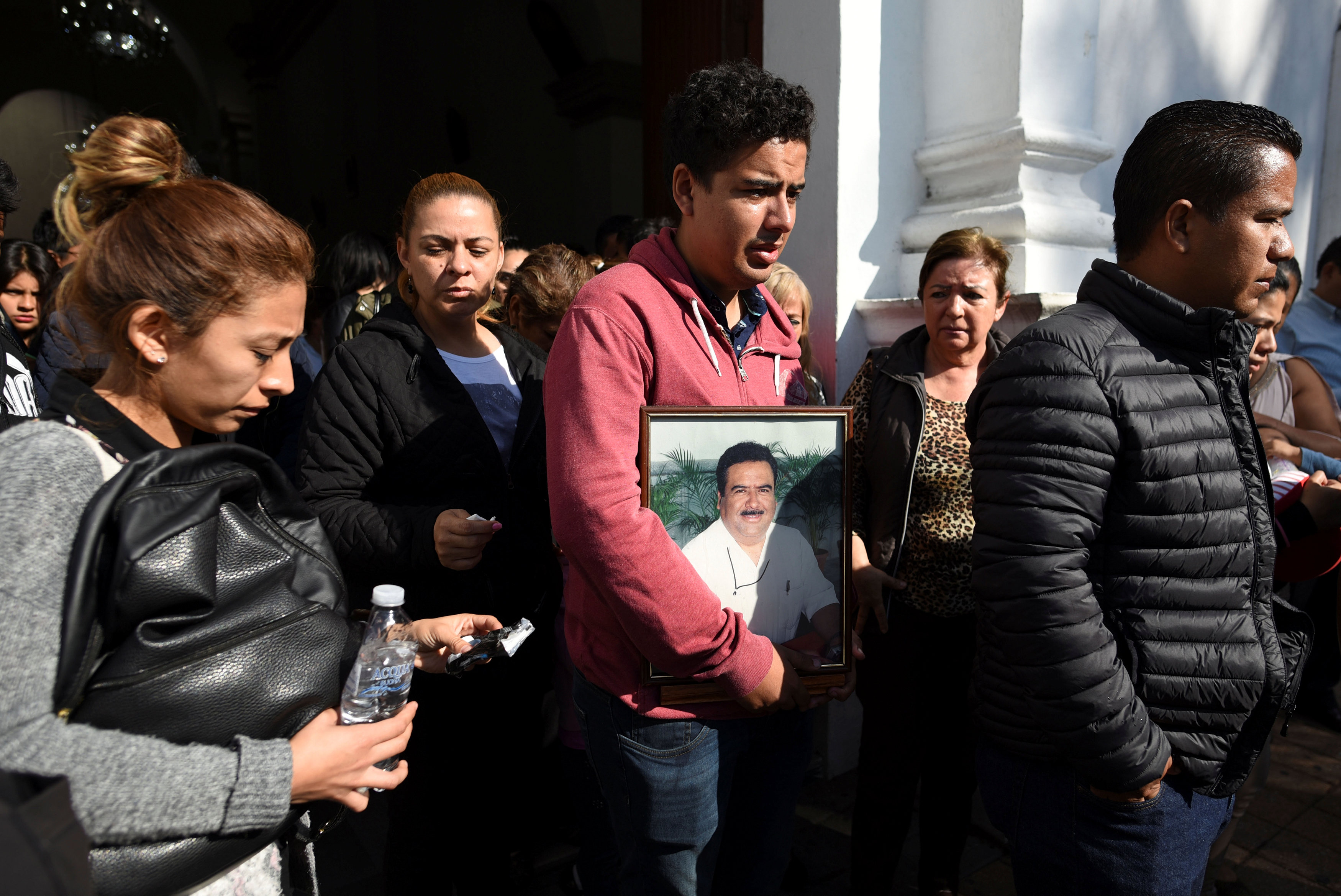 Relatives and friends of slain journalist Ricardo Monlui leave a church after his funeral mass in Cordoba, in the Mexican state of Veracruz, Mexico on March 20, 2017. (REUTERS/Yahir Ceballos)