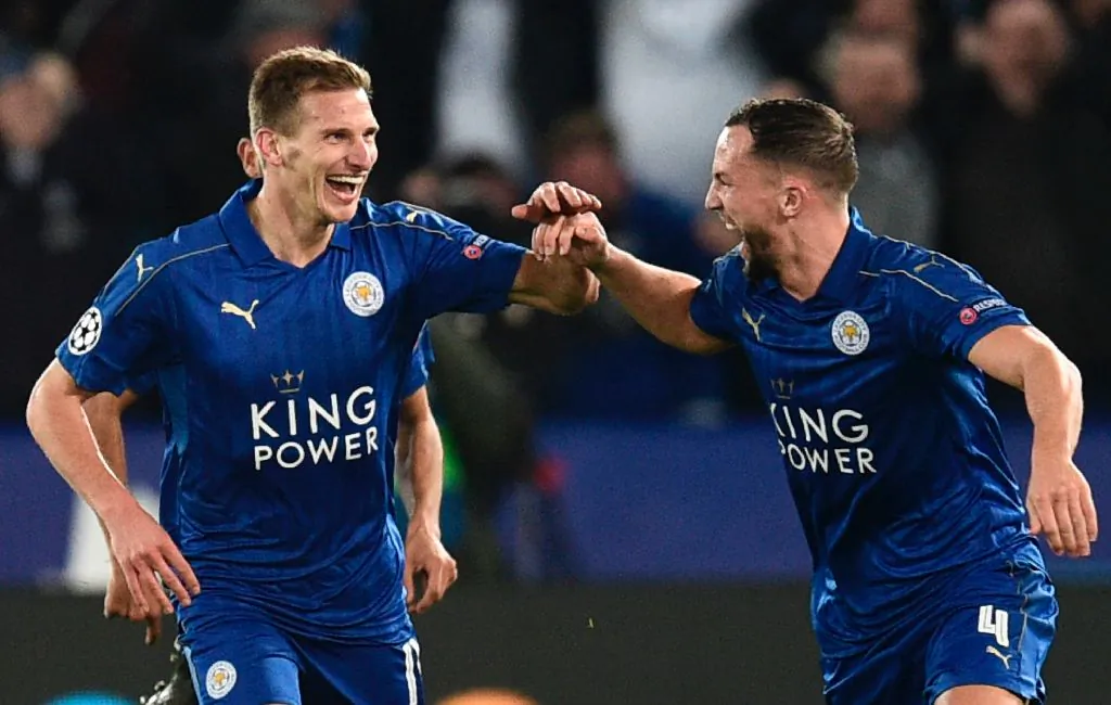Leicester City's English midfielder Marc Albrighton (L) celebrates scoring their second goal with Leicester City's English midfielder Danny Drinkwater (R) during the UEFA Champions League round of 16 second leg football match between Leicester City and Sevilla at the King Power Stadium on March 14, 2017. (Oli Scarff/AFP/Getty Images)