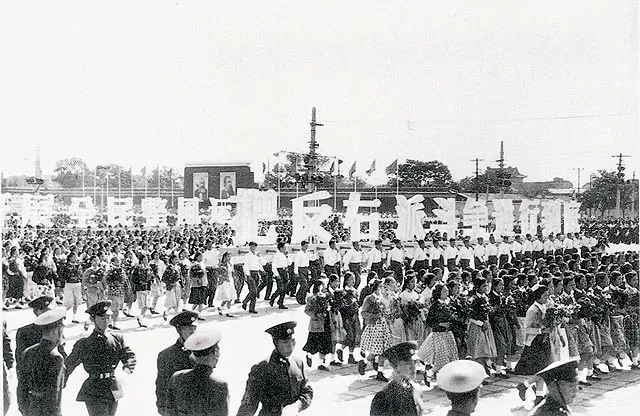One of many 1950s Chinese parades showing support for the communist political movement. (Public Domain)