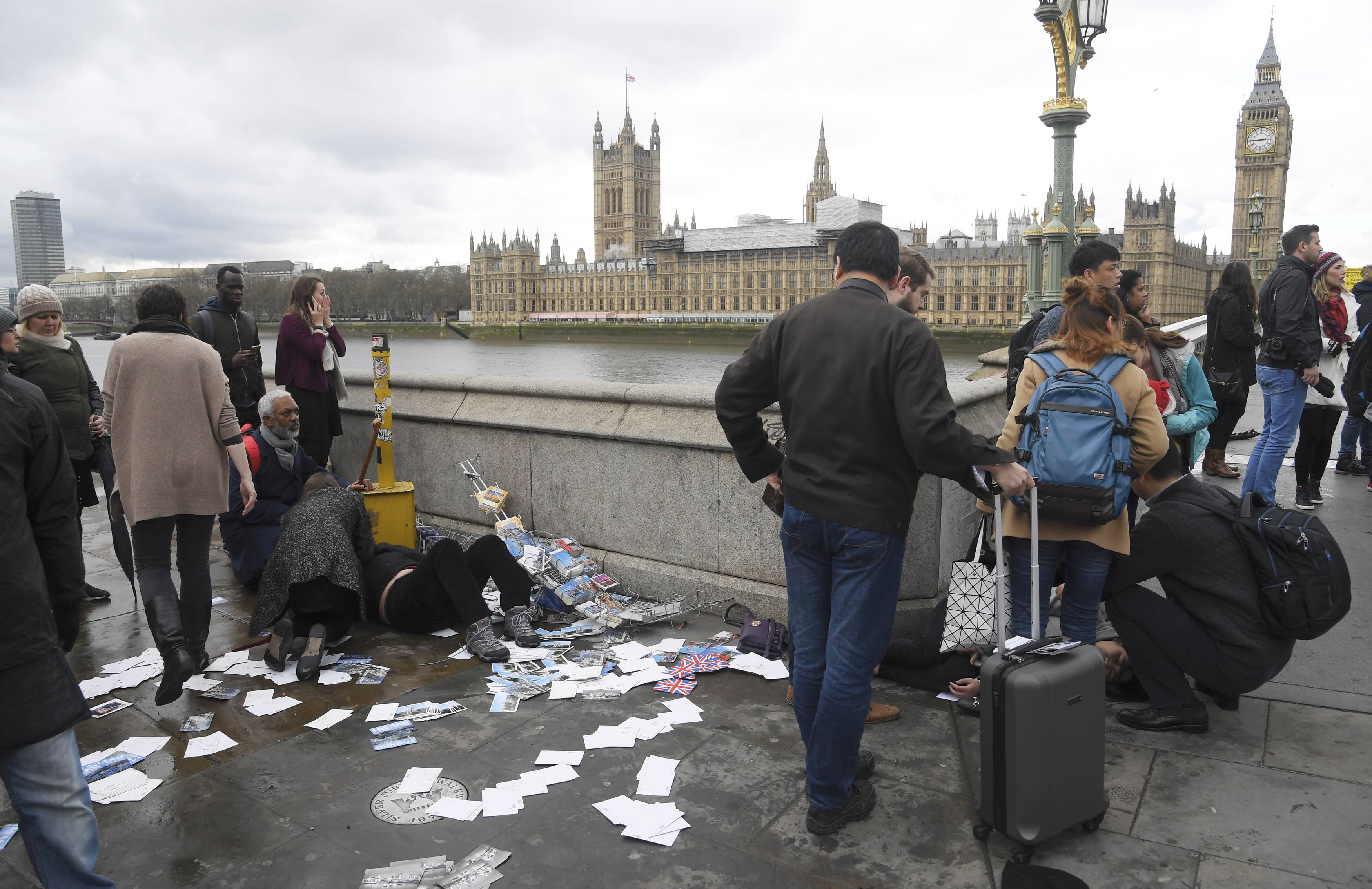 Injured people are assisted after an incident on Westminster Bridge in London on March 22, 2017. (REUTERS/Toby Melville)