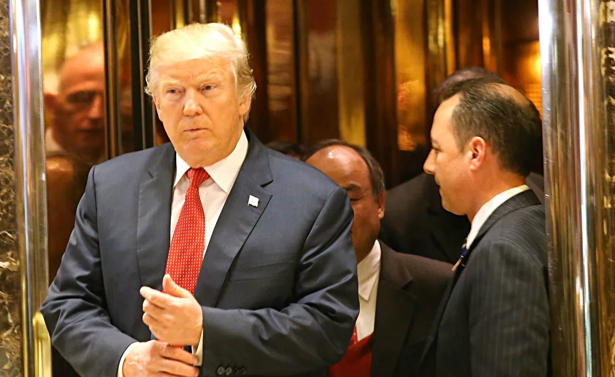 President-elect Donald Trump walks out of an elevator speak to the media at Trump Tower in New York City on Dec. 6, 2016. Potential members of President-elect Donald Trump's cabinet have been meeting with him and his transition team of the last few weeks. (Spencer Platt/Getty Images)