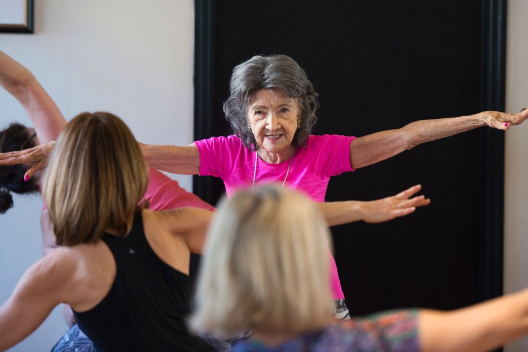 Yoga master Tao Porchon-Lynch  instructs a yoga class in Hartsdale, N.Y., on Jan. 16, 2017. The 98-year-old Porchon-Lynch has been recognized by Guinness World Records as the world's oldest yoga instructor. (DON EMMERT/AFP/Getty Images)