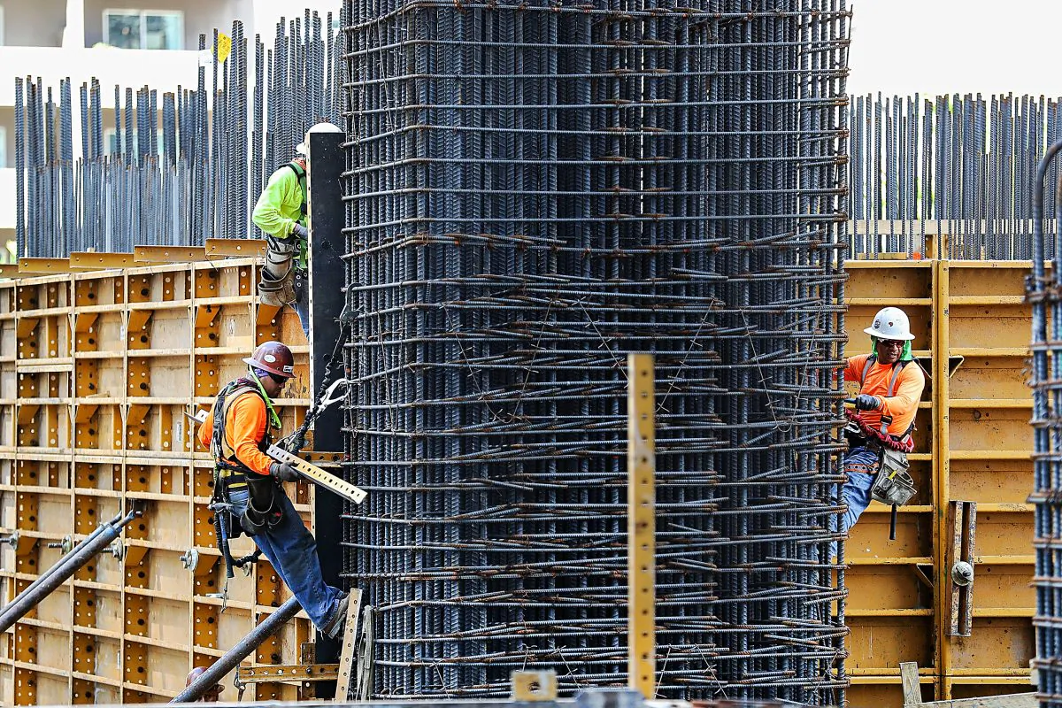 Construction workers in Miami on March 10. According to a new survey, the nonresidential construction sector expects business to grow, based on promises of big infrastructure spending. (Joe Raedle/Getty Images)