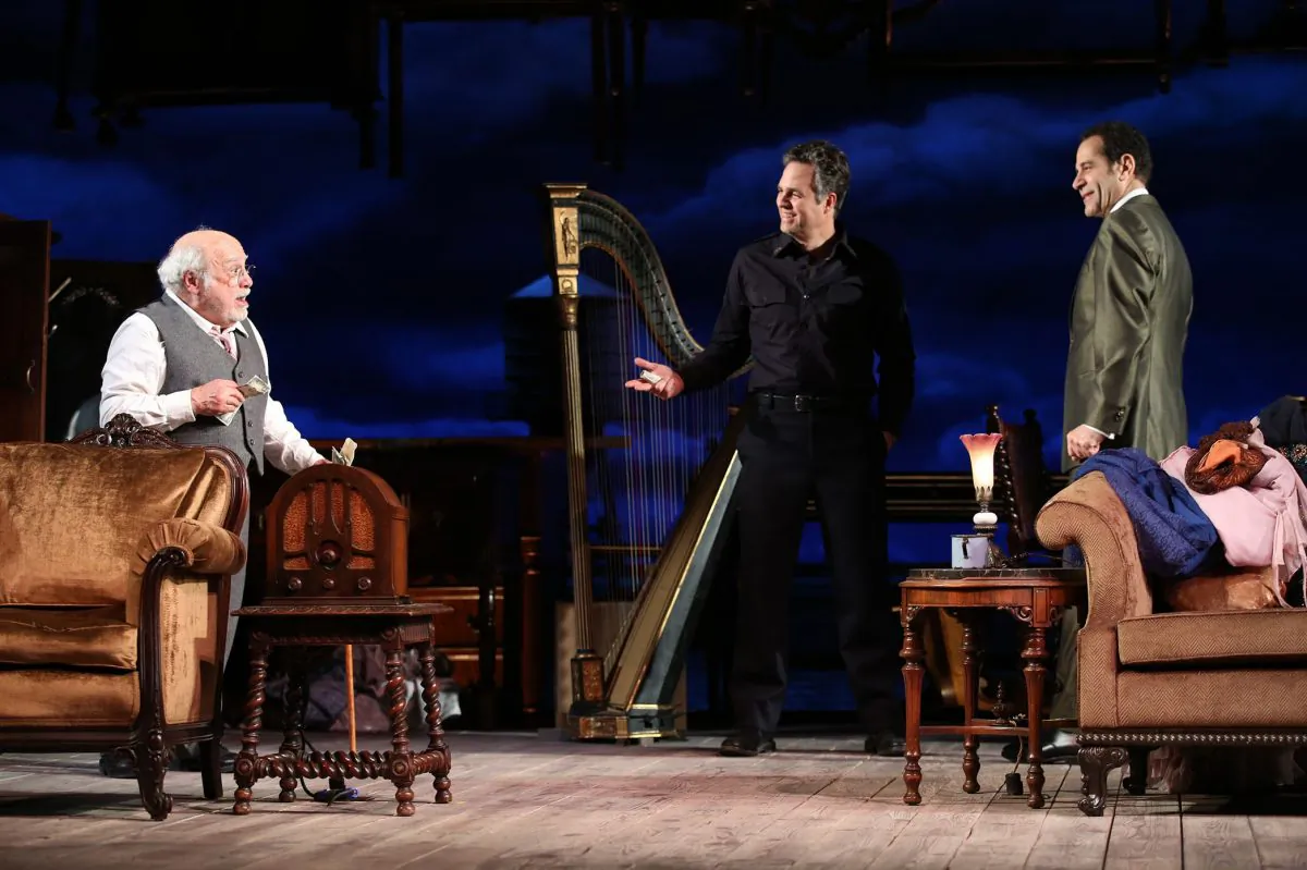 (L–R) Gregory Solomon (Danny DeVito), a furniture dealer, is appraising the inherited belongings of brothers Victor (Mark Ruffalo) and Walter Franz (Tony Shalhoub) after the death of their parents, in “The Price.” (Joan Marcus)