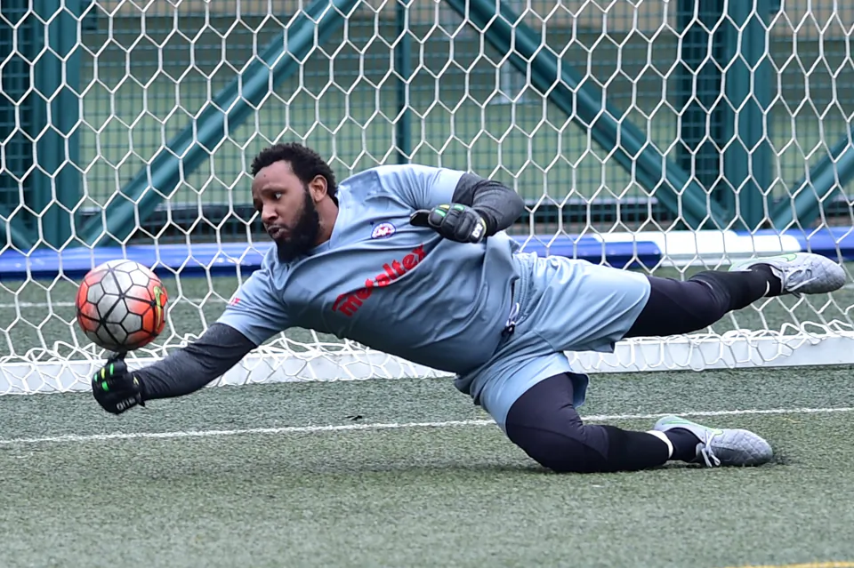 French Kiss Goalie, Jamil Bausi, was kept busy during their match against Yau Yee League, Division 1 leaders Club Albion, from frequent Albion attacks, he made a number of impressive saves including this one during their 4-0 defeat at Sports Road on March 26, 2017. (Bill Cox/Epoch Times)