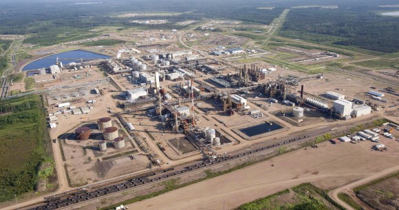 A Nexen oil sands facility near Fort McMurray, Canada, is seen in this aerial photograph on July 10, 2012. Nexen was sold to China's CNOOC Ltd. in December 2012. (The Canadian Press/Jeff McIntosh)