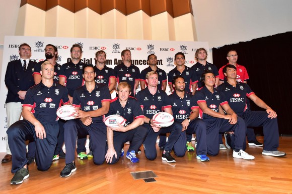 Hong Kong Men's squad: together with (L) Robbie McRobbie Deputy CEO of the HKRU, and (R) coach Paul John: Back Row (L-R): Michael Coverdale, Ryan Meacheam, Tom McQueen, Lee Jones, Ben Rimene, Rowan Varty, Mark Wright, Paul John (coach). Front Row: Max Woodward (Capt), Chris Maize, Toby Fenn, Jamie Hood, Jason Jeyam, Cado Lee Ka-to, Salom Yiu Kam-shing. (Bill Cox/Epoch Times)