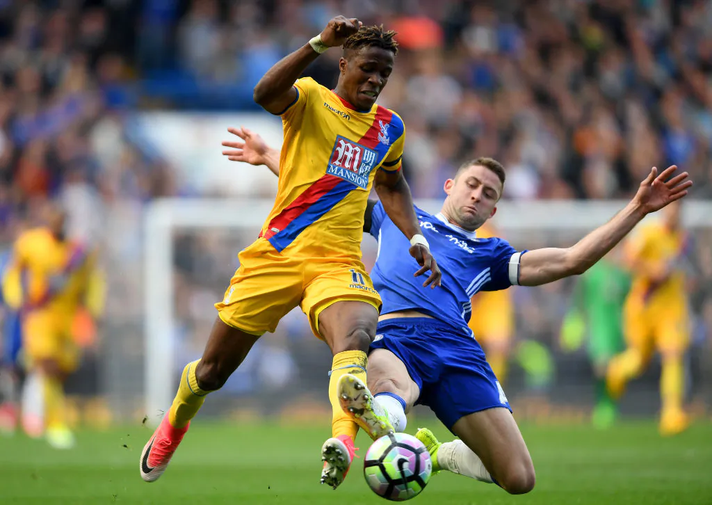 Wilfried Zaha of Crystal Palace (L) is tackled by Gary Cahill of Chelsea (R) during the Premier League match between Chelsea and Crystal Palace at Stamford Bridge on April 1, 2017 in London, England. (Mike Hewitt/Getty Images)