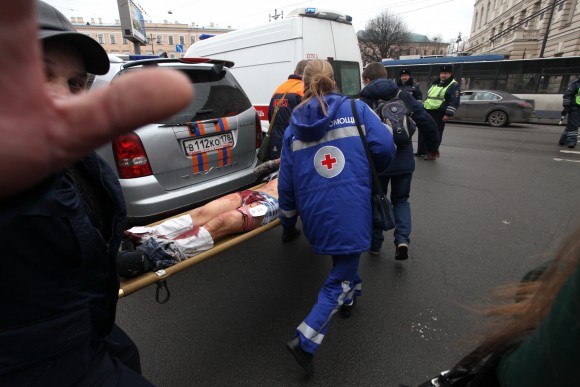 Paramedics carrie a subway blast victim into an ambulance after explosion at Tekhnologichesky Institut subway station in St.Petersburg, Russia April 3, 2017. The subway in the Russian city of St. Petersburg is reporting that there are fatalities and several people have been injured in an explosion on a subway train. (Alexander Tarasenkov/Interpress via AP)
