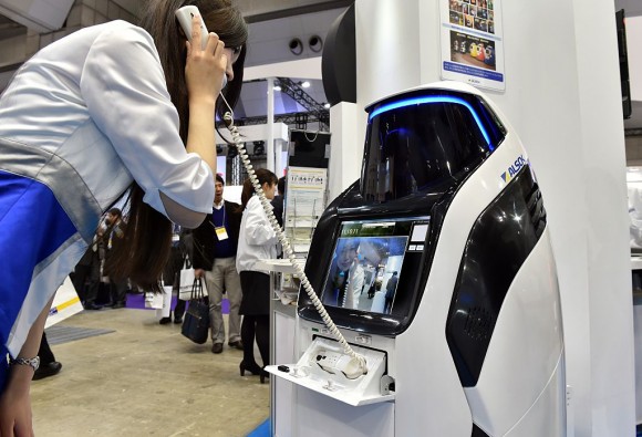 Japan's security company Alsok displays the newly developed security and guide robot "Reborg-X", which guides visitors and shoppers in the day time while it patrols a shopping mall autonomously at the annual Security Show in Tokyo on March 4, 2015. Some 170 Japanese and foreign security related companies display their latest products and services at the event. AFP PHOTO / Yoshikazu TSUNO (Photo credit should read YOSHIKAZU TSUNO/AFP/Getty Images)