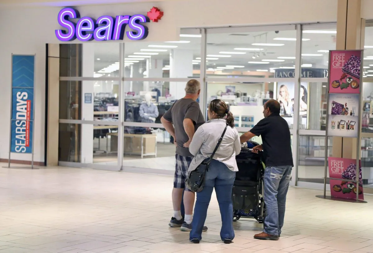 A Sears store entrance at the Marlborough Mall in Calgary. The large department store is no longer providing a solid anchor for shopping malls. (The Canadian Press/Mike Ridewood)