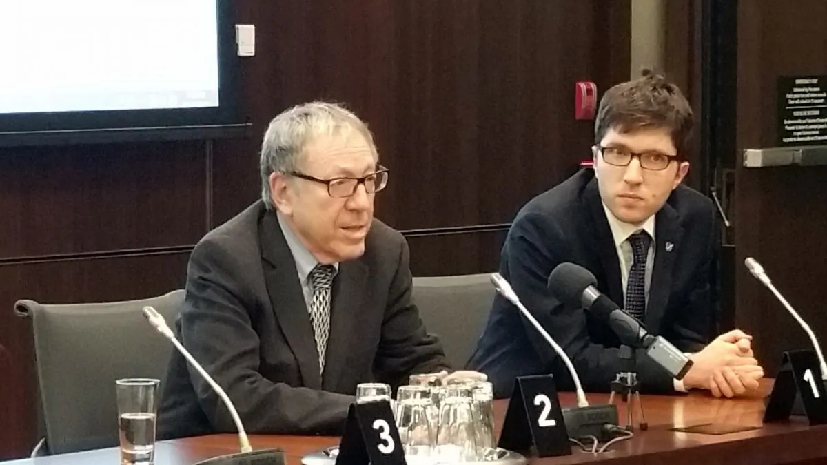 Former Liberal justice minister and attorney general Irwin Cotler and Conservative MP Garnett Genuis speak after the screening of “The Bleeding Edge” in Ottawa on April 4, 2017. Genuis and Cotler are among co-chairs of the recently formed Inter-Parliamentary Alliance on China. (The Epoch Times)