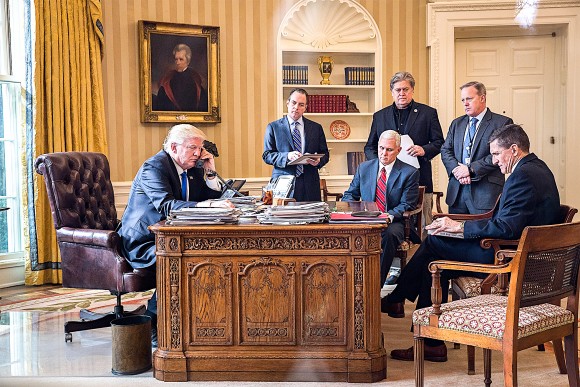 President Donald Trump speaks on the phone with Russian President Vladimir Putin in the Oval Office of the White House in Washington on, Jan. 28, 2017. Also pictured, from left, White House Chief of Staff Reince Priebus, Vice President Mike Pence, and White House Chief Strategist Steve Bannon. (Drew Angerer/Getty Images)