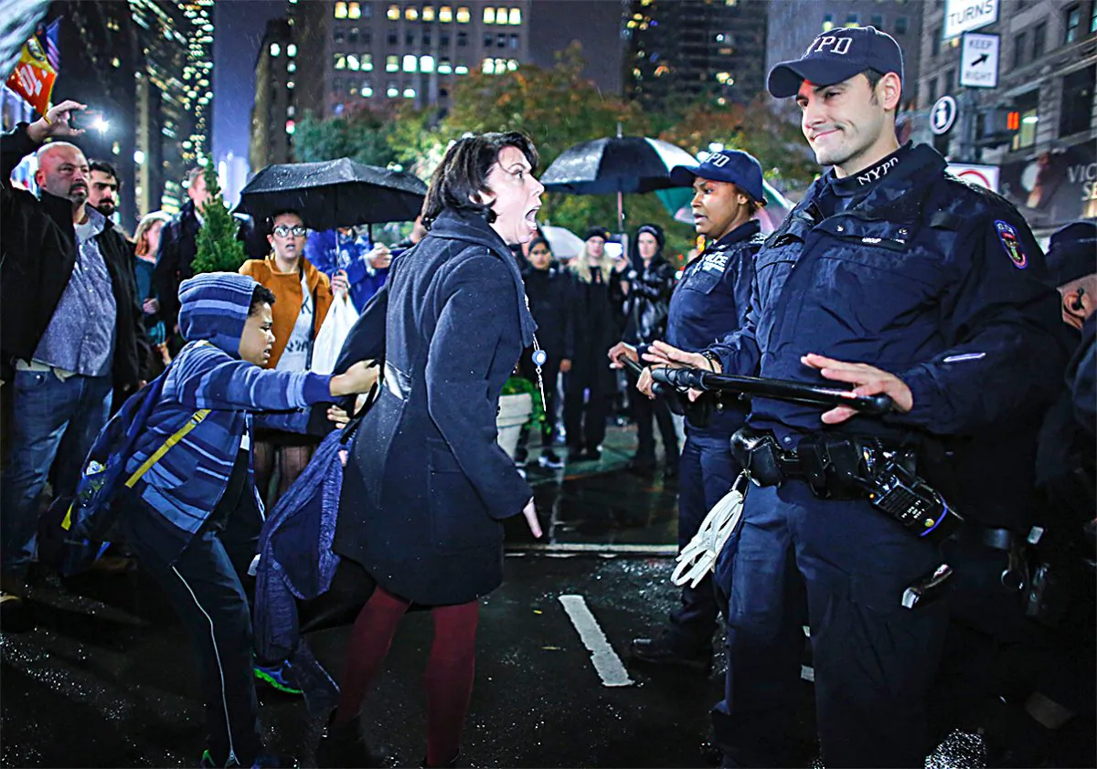A woman argues with police officers during a protest against President-elect Donald Trump in New York on Nov. 9, 2016. (KENA BETANCUR/AFP/Getty Images)