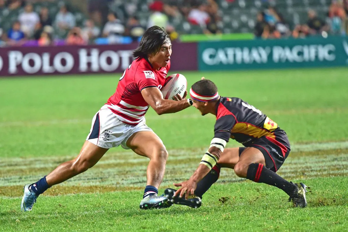 Cado Lee of Hong Kong makes valiant attempt to score but Heatbreak for Hong Kong as Germany win 14-7 in the Sevens Qualifier competition at Hong Kong Stadium on April 8, 2017. (Bill Cox/Epoch Times)