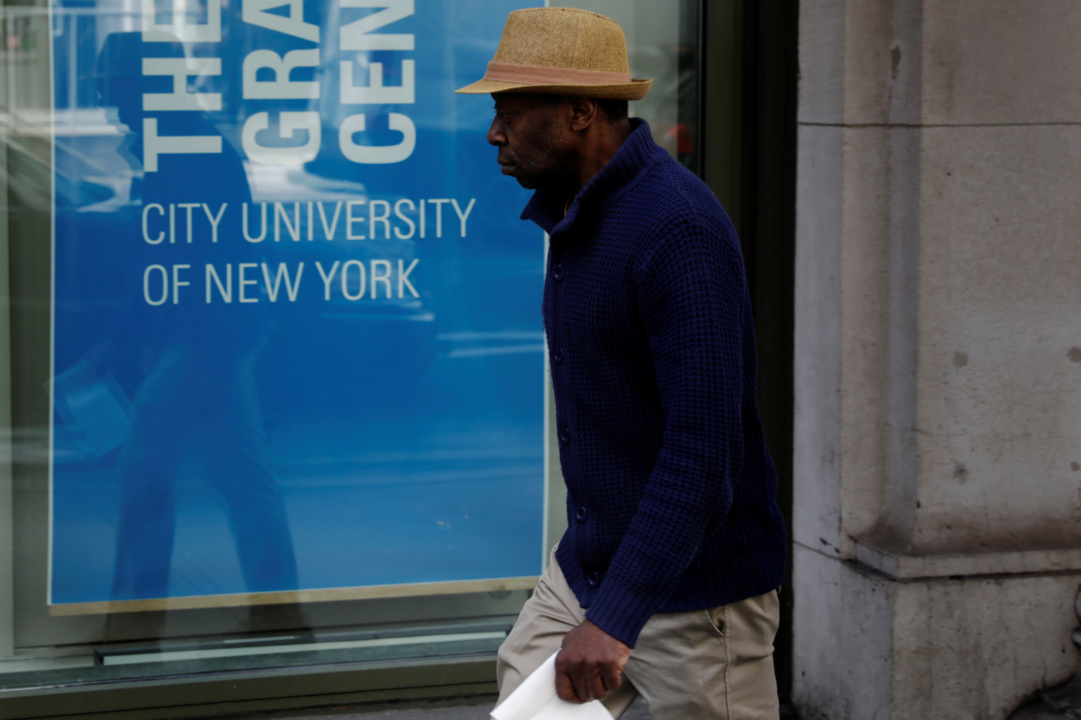 A pedestrian walks past a City University of New York building in New York on April 11, 2017. (REUTERS/Lucas Jackson)