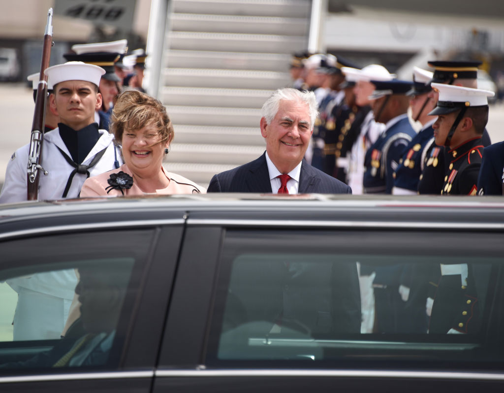 US Secretary of State Rex Tillerson and his wife Renda St. Clair wait to greet the President of the People's Republic of China Xi Jinping and his wife Peng Liyuan as they arrive to Palm Beach International Airport in West Palm Beach, Fla., on April 6, 2017.(MICHELE EVE SANDBERG/AFP/Getty Images)