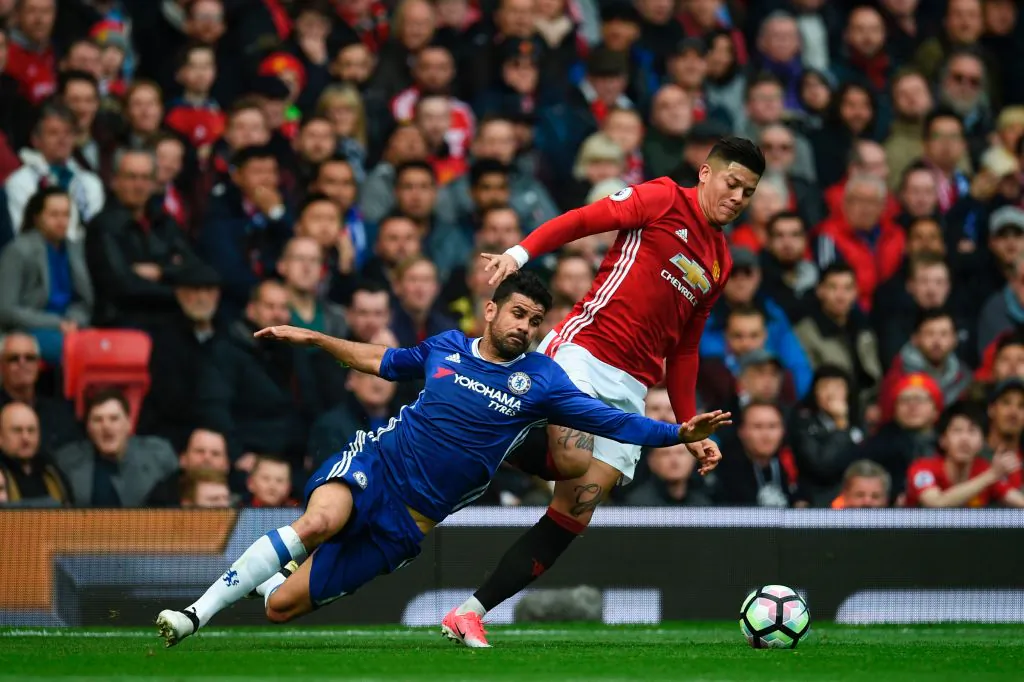 Chelsea's Brazilian-born Spanish striker Diego Costa (L) vies with Manchester United's Argentinian defender Marcos Rojo during the English Premier League football match between Manchester United and Chelsea at Old Trafford in Manchester, England, on April 16, 2017. (Oli Scarff/AFP/Getty Images)