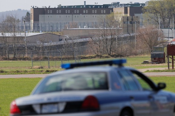 Prison officials patrol the roads around the Souza Baranowski Correctional Center in Shirley, Massachusetts, U.S., where former New England Patriots player Aaron Hernandez was found dead in his jail cell April 19, 2017. (REUTERS/Brian Snyder)
