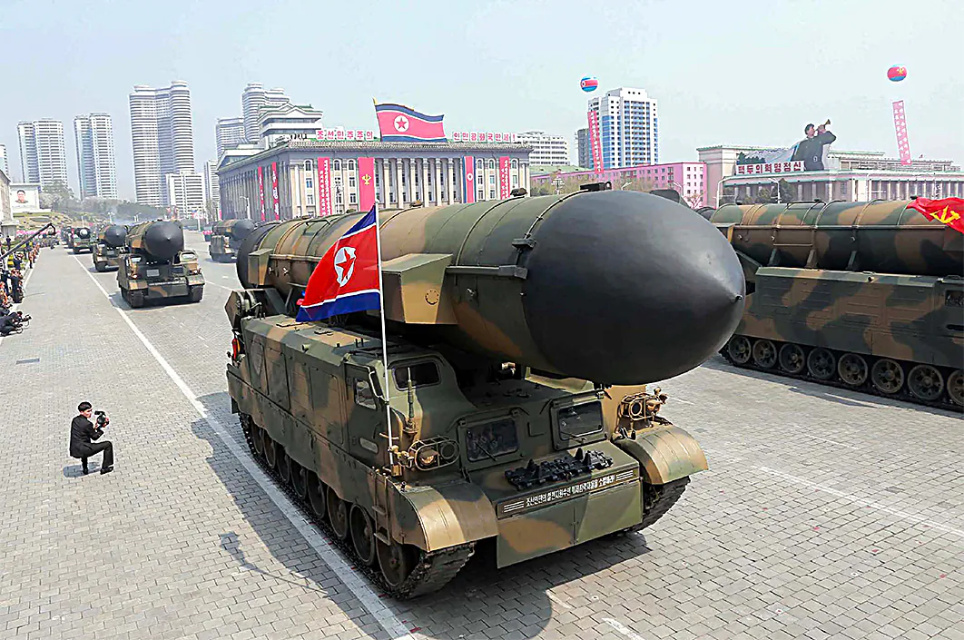 A North Korean ballistic missile launcher on parade in this file photo. North Korea received Chinese aid for its nuclear and rocket programs. (STR/AFP/Getty Images)