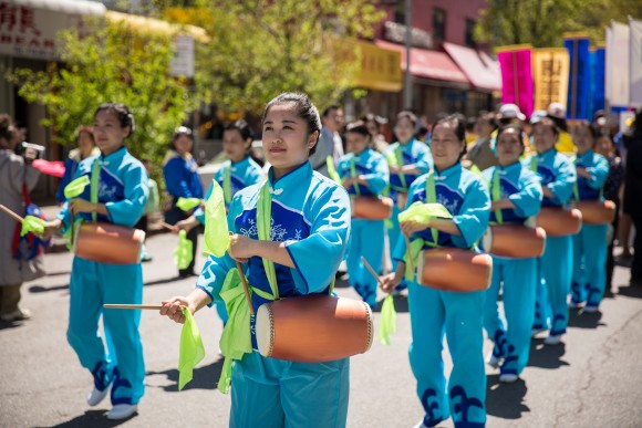 Falun Gong practitioners march in a parade in Flushing, New York, on April 23, 2017, to commemorate the 18th anniversary of the April 25th peaceful appeal of 10,000 Falun Gong practitioners in Beijing. (Benjamin Chasteen/The Epoch Times)