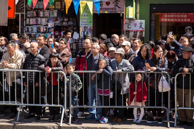 Falun Gong practitioners march in a parade in Flushing, New York, on April 23, 2017, to commemorate the 18th anniversary of the April 25th peaceful appeal of 10,000 Falun Gong practitioners in Beijing. (Benjamin Chasteen/The Epoch Times)