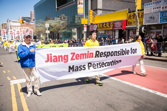 Falun Gong practitioners march in a parade in Flushing, New York, on April 23, 2017, to commemorate the 18th anniversary of the April 25th peaceful appeal of 10,000 Falun Gong practitioners in Beijing. (Benjamin Chasteen/The Epoch Times)
