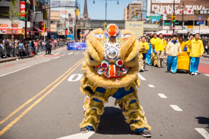 Falun Gong practitioners march in a parade in Flushing, New York, on April 23, 2017, to commemorate the 18th anniversary of the April 25th peaceful appeal of 10,000 Falun Gong practitioners in Beijing. (Benjamin Chasteen/The Epoch Times)