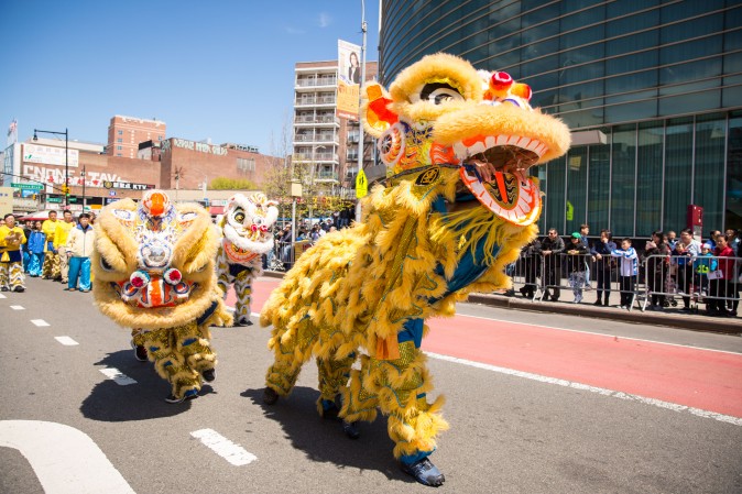 Falun Gong practitioners march in a parade in Flushing, New York, on April 23, 2017, to commemorate the 18th anniversary of the April 25th peaceful appeal of 10,000 Falun Gong practitioners in Beijing. (Benjamin Chasteen/The Epoch Times)