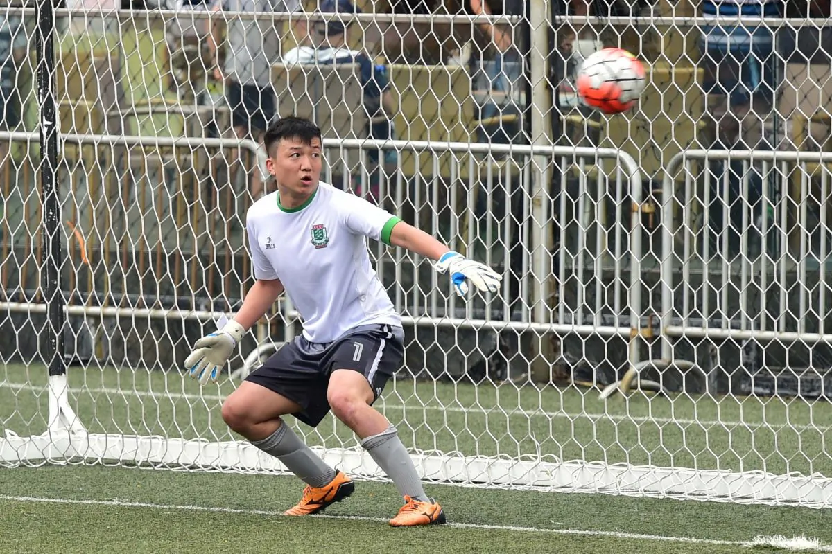 KCC Knights goalie , Wong Chi Chuen has little time to react from this penalty kick taken by Antoine Gael Sahagian of Club Albion in the Yau Yee League Division 1 match at Sports Road on Sunday April 23, 2017.League leaders Albion dominated the game winning 6-0. (Bill Cox/Epoch Times)
