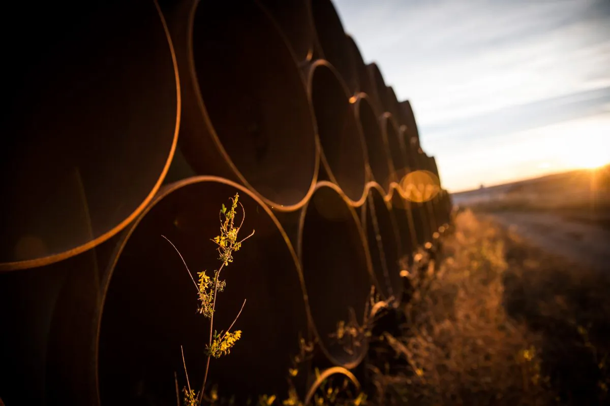 Miles of unused pipe, prepared for the proposed Keystone XL pipeline, sit in a lot outside Gascoyne, N.D., on Oct. 14, 2014. (Andrew Burton/Getty Images)