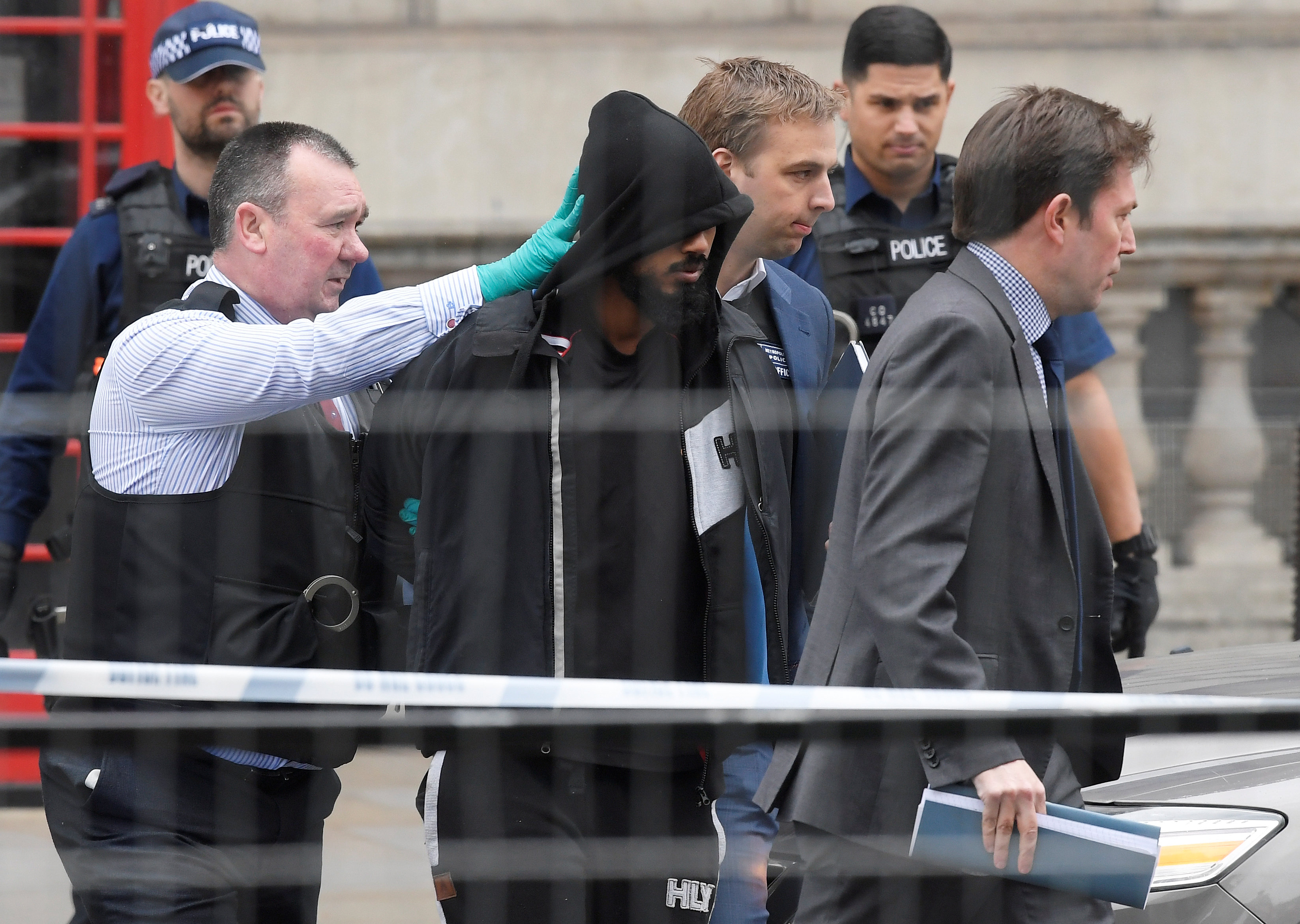 A man is led away by police in Westminster after an arrest was made on Whitehall in central London, Britain on April 27, 2017. (REUTERS/Toby Melville)