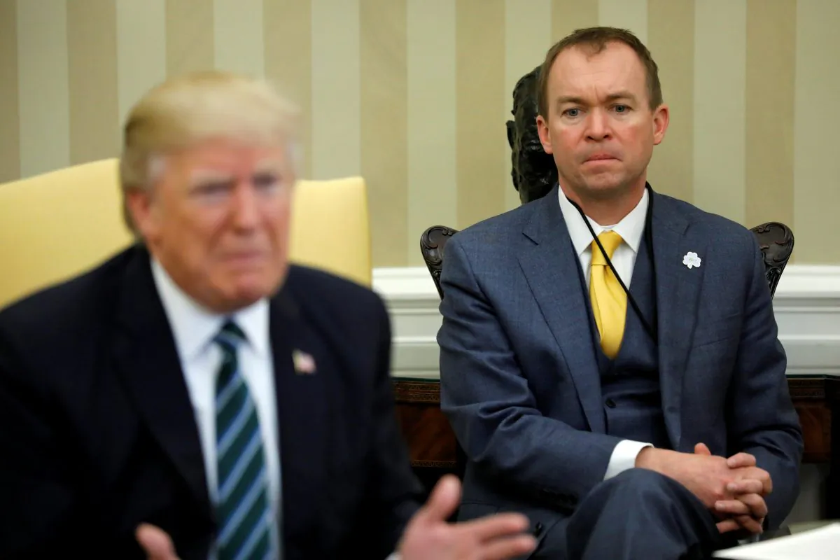 Mick Mulvaney (R) listens as then-President Donald Trump meets with members of the Republican Study Committee at the White House in Washington, U.S. on March 17, 2017. (Jonathan Ernst/Reuters)